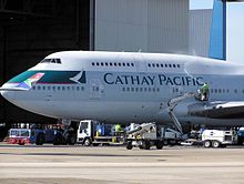 A Cathay Pacific Boeing 747-400 being cleaned at London Heathrow Airport