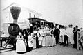 Passengers posing in front of the "Ferrocarril de Manila and Dagupan" (circa 1885)