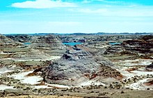 aerial view of the canyon with mesas and creek in background