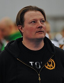 Kari-Jukka Hietalahti wearing black hoodie, looking up and left of camera