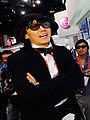 Korean rock star Kim Jang-hoon wearing 1970s style velvet jacket, poet shirt and beret