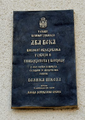 Commemorative plaque on the wall of the Great School building, S. Negovanović