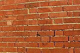 Defective pointing can allow rain to penetrate through masonry walls