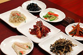 Various banchan served at a table