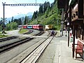 A train approaches the station - note the level crossing