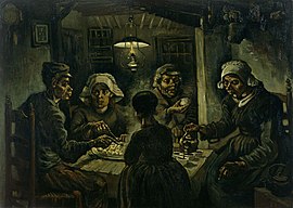 Two men and three women eating potatoes