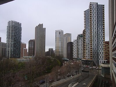 The emerging cluster in Lewisham also known as Lewisham Gateway, and first Borough of Sanctuary,[503] which includes 209 Connington Road Tower at 117m tall which is the white building in the centre and Lewisham Exchange at 105m tall to the left of it. All of the high-rises shown in this picture are residential with the exception of the grey building shown in the immediate right foreground which was formerly the London offices of Citigroup until they relocated to 25 Canada Square at Canary Wharf in 2001