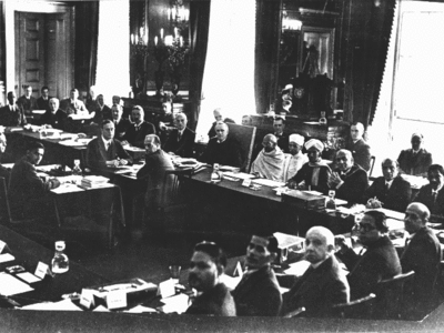 British prime minister, Ramsay MacDonald, three places to the right of Gandhi (to the viewer's left) at the 2nd Round Table Conference. Samuel Hoare is two places to Gandhi's right. Foreground, fourth from left, is B. R. Ambedkar representing the "Depressed Classes"