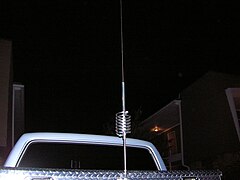 CB antenna with loading coil, mounted on pickup-truck metal tool box