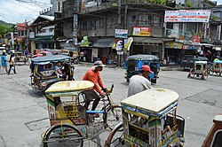 Rickshaws along a street in Catbalogan