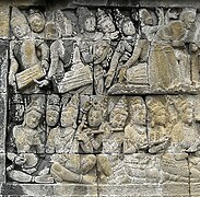 Musicians performing a musical ensemble, probably the early form of gamelan.