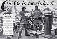 Advertisement showing two men in heavy clothing on the deck of a ship, with icy mountains in the background. The men are pouring drinks from a jug, The slogan reads "Oxo in the Antarctic"