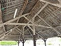 Ridge posts extend to the ridge beams. Ridge post framing is a type of post and lintel framing from ancient times. A market hall in Chesnois-Auboncourt, Ardennes, France.