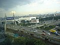 The cable bridge of Damansara-Puchong Expressway spanning over its intersection with Federal Highway in Petaling Jaya. Kuala Lumpur can be seen in the distant background on the right corner of the picture.