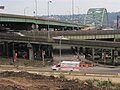 Truck on Forbes Avenue passing a ramp of the Birmingham Bridge in battered old Soho