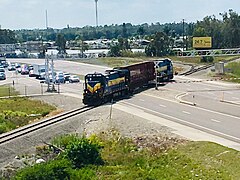 Seminole Gulf freight train crossing Alico Road near the Baker Spur junction south of Fort Myers