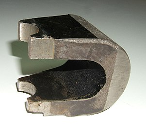 Alnico horseshoe magnet used in a magnetron tube in an early microwave oven. About 3 in (8 cm) long.