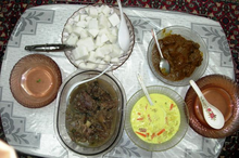 4 dishes on a table traditionally eaten during Hari Raya Puasa or Hari Raya Haji.