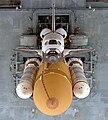 An overhead view of Atlantis as it sits atop the Mobile Launcher Platform (MLP) before STS-79. Two Tail Service Masts (TSMs) to either side of the orbiter's tail provide umbilical connections for propellant loading and electrical power.