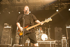 Phil Rind performing with Sacred Reich at Gelenkirchen Rock Hard Festival in 2014