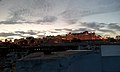 City Palace in evening light with Old Udaipur in front.