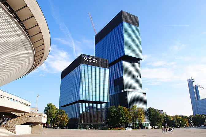 The buildings to the left and right of the conference venue. I coined the term "Lego building" to refer to the latter when giving people directions and it caught on. Someone else coined "UFO" to refer to building on the left.