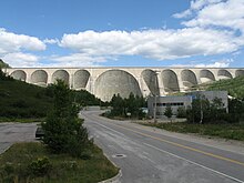 A large concrete dam with multiple arches