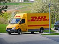 A Deutsche Post Mail Mercedes-Benz Sprinter van using the DHL trademark