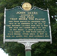 A monument in Middlebury, Vermont marking the shop in the town where John Deere learned the blacksmith trade