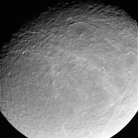 Image of the wispy hemisphere, showing ice cliffs – Powehiwehi (upper center); chasmata stretch from upper left to right center – Onokoro Catenae (lower right)