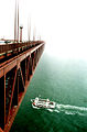 The Golden Gate Bridge extending into the fog, on a typical July day