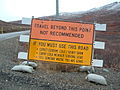 Sign north of Nome, Alaska, providing warning of the remote, unpopulated area beyond