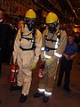 British naval men in firefighting gear on HMS Illustrious (R06), Liverpool, 25 October 2009