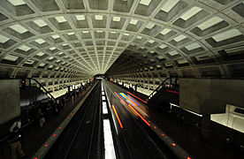 A train departs from McPherson Square station (opened 1977), which has an original ceiling vault design