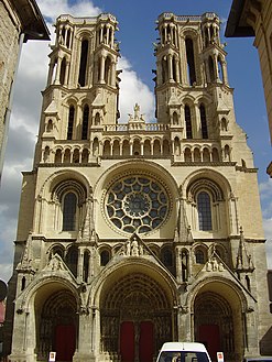 The facade of Laon Cathedral, 1225, a Gothic cathedral, maintains rounded arches and arcading in the Romanesque manner.