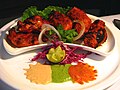 Image 18Chicken tikka, a well-known dish across the globe, reflects the South Asian cooking style. (from Culture of Asia)