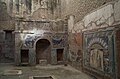 The house is noted for this outstanding summer triclinium with a nymphaeum decorated with coloured mosaics