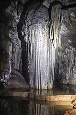 Hawk Cave (Arabic: كهف هوق) in the east of the island