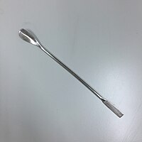 A stainless steel laboratory spatula