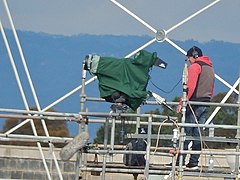 A camera operator working on an outside broadcast at the Football Park in Adelaide