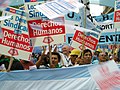 Image 15Union members march in Argentina on Human Rights Day in December 2005. The signs read "Worker rights are human rights..