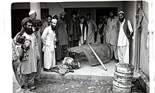 English: Afghans in Peshawar showing off canopy of downed Soviet jet, 1984.