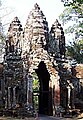 Stone corbelled gateway arch to walls of Angkor Thom in Cambodia