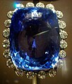 Blue sapphire, a gemstone of the mineral corundum. Trace amounts of iron colour it blue; if there are traces of chromium instead, it has a red tint and is called a ruby.