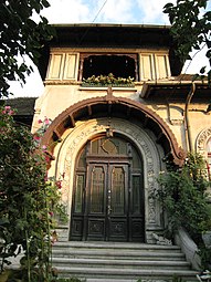 Door of a house in Ploiești, with a wooden awning, by Toma T. Socolescu