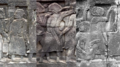 A figure wearing a shawl likesbai depicted on Bayon temple