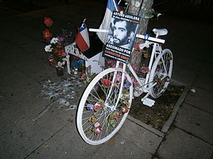 Ghost bike or "Bicianimita" in Chile, with a traditional small house for the soul of a traffic violence victim, 2013 Douglas Crow, struck February 15, 2013 in Provo, Utah, United States