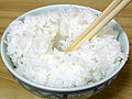 4. Dig a hollow in the center of the cooked rice in the Chawan (茶碗, a rice bowl) using chopsticks.