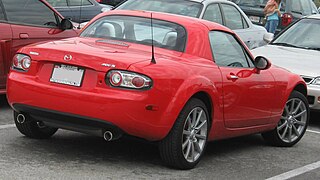 Mazda Miata Power Retractable Hard Top (PRHT) c. 2007, with 77 lb (35 kg) polycarbonate hardtop and identical cargo capacity to the soft top version[21]