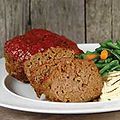 A meatloaf with a tomato sauce topping.